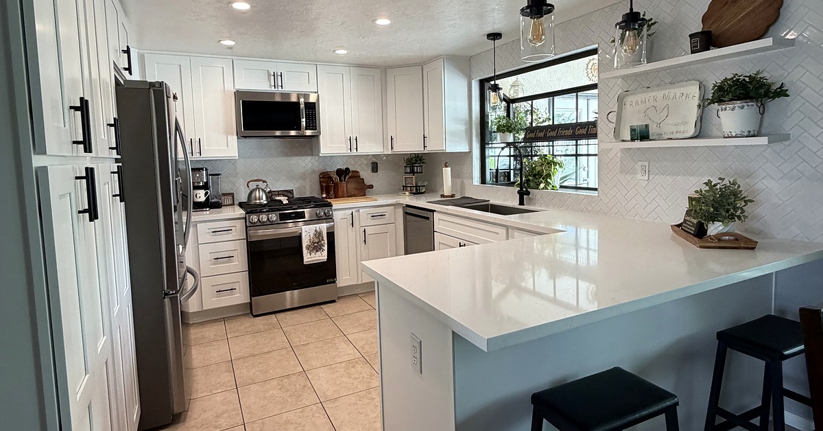 Completed white kitchen remodel with quartz counters by K&A Builders